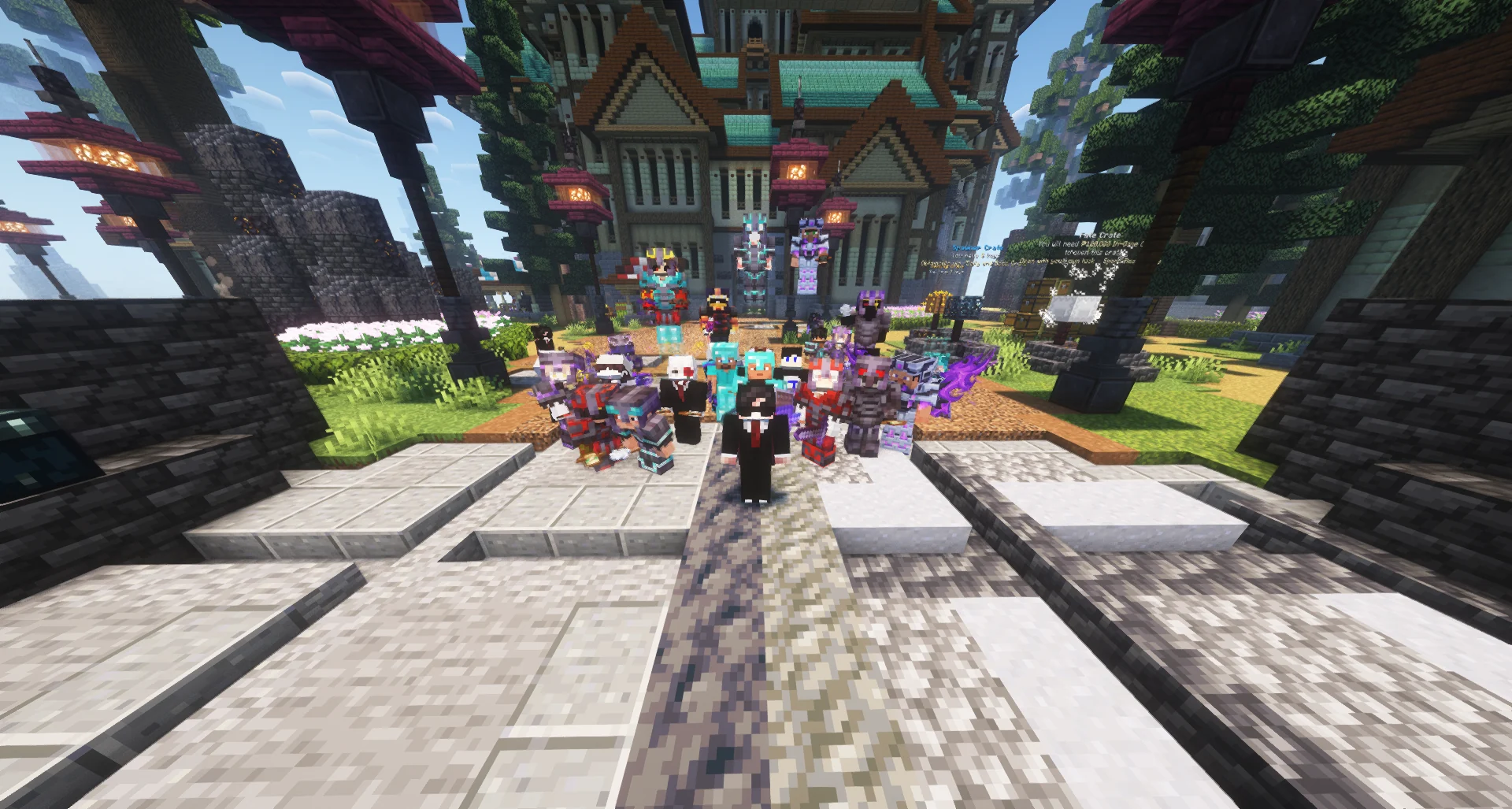 A crowd of Minecraft players on a stone walkway surrounded by timber-and-teal buildings.